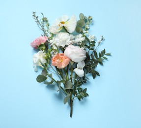 Photo of Different beautiful flowers on light blue background, flat lay