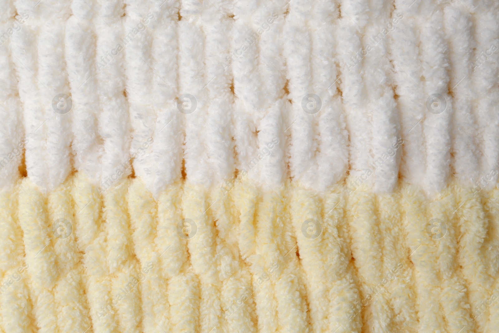 Photo of Soft knitted fabric as background, top view