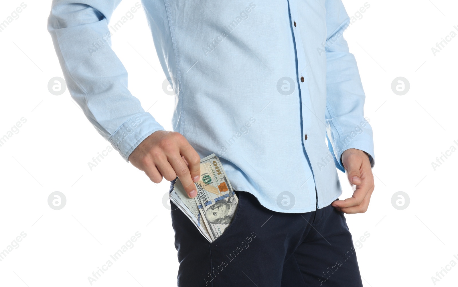 Photo of Man putting bribe money into pocket on white background, closeup