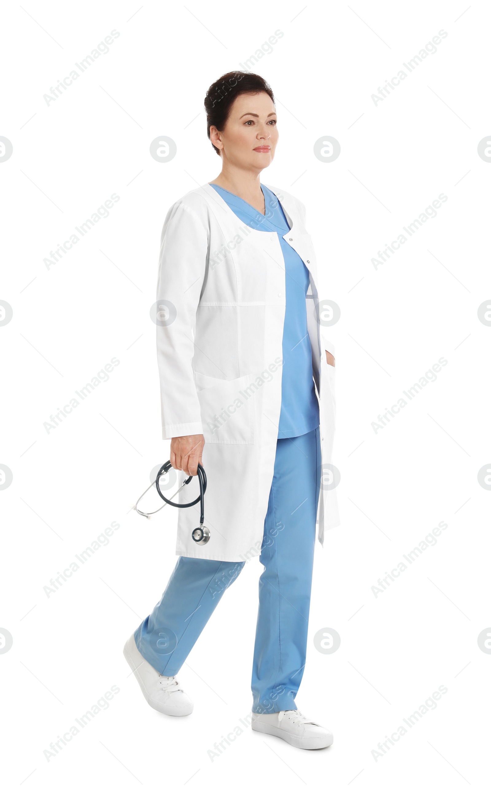 Photo of Full length portrait of female doctor isolated on white. Medical staff