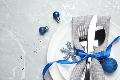 Beautiful Christmas table setting on grey background, flat lay