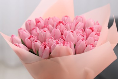 Bouquet of beautiful pink tulips on blurred background, closeup