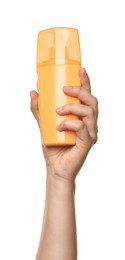 Woman holding plastic bottle of cosmetic product on white background, closeup