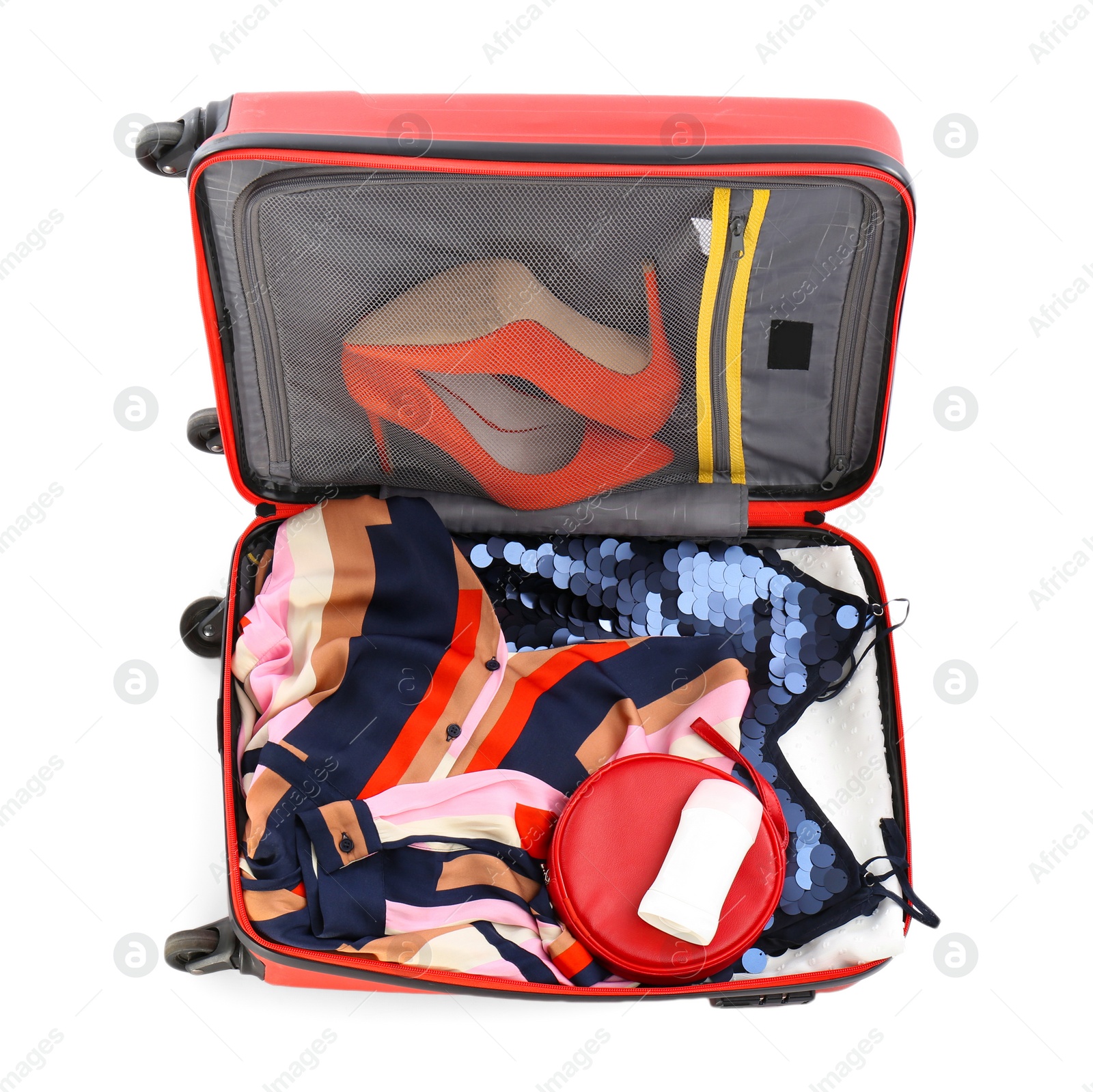 Photo of Packed suitcase with deodorant and clothes on white background, top view