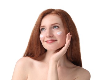 Photo of Beautiful woman with freckles and cream on her face against white background