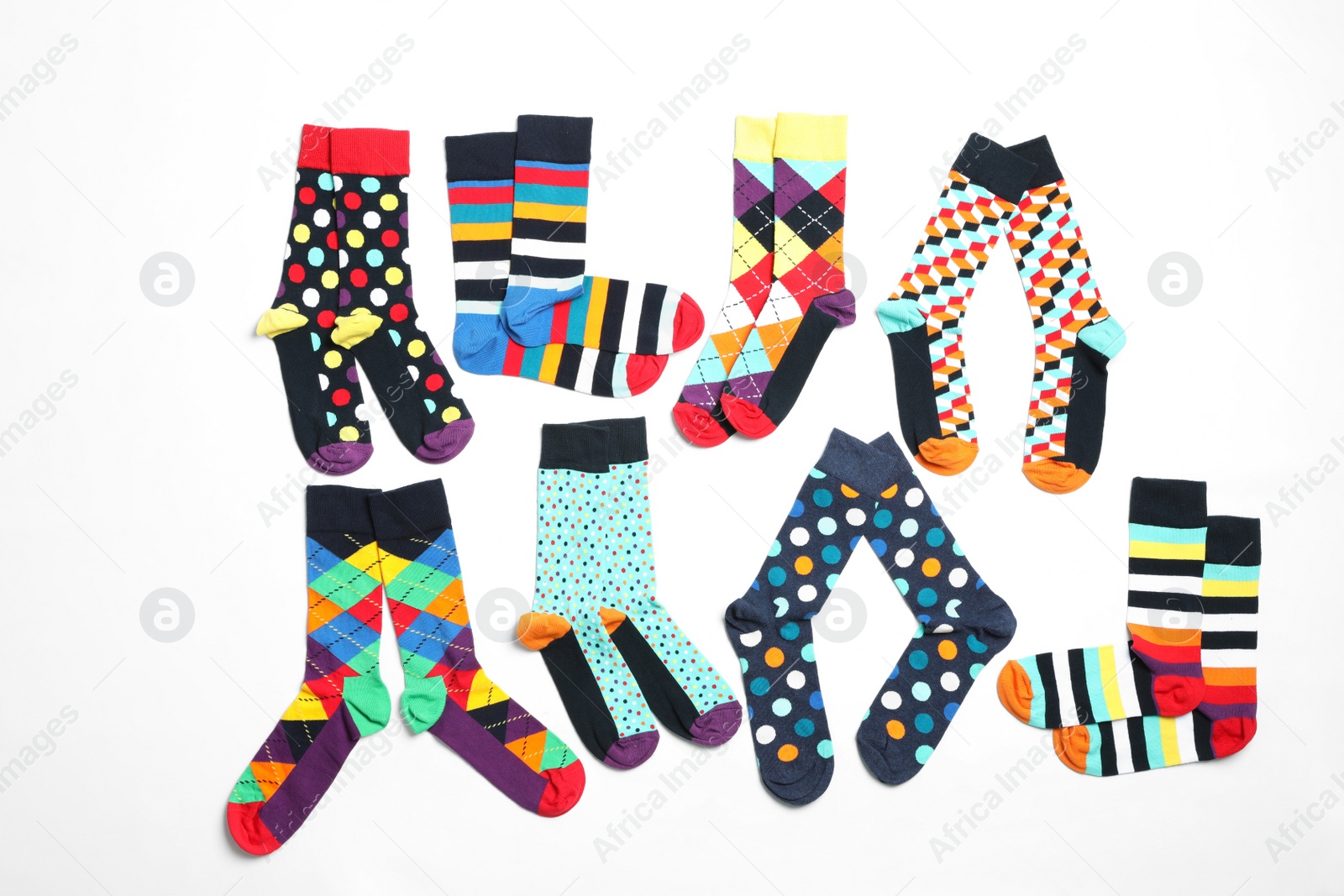 Photo of Flat lay composition with different colorful socks on white background