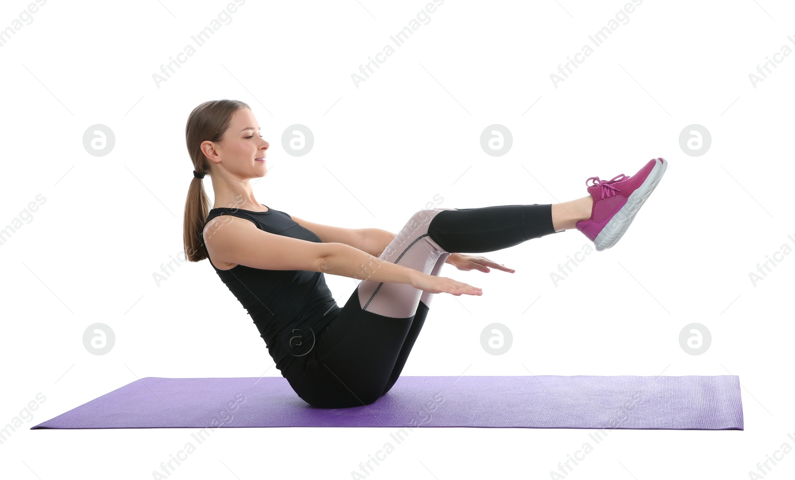 Photo of Young woman doing sports exercises isolated on white. Home fitness