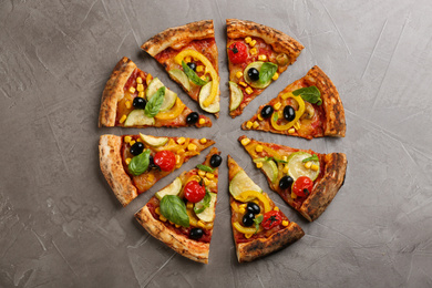 Photo of Delicious vegetable pizza on grey table, flat lay