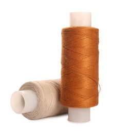 Different colorful sewing threads on white background