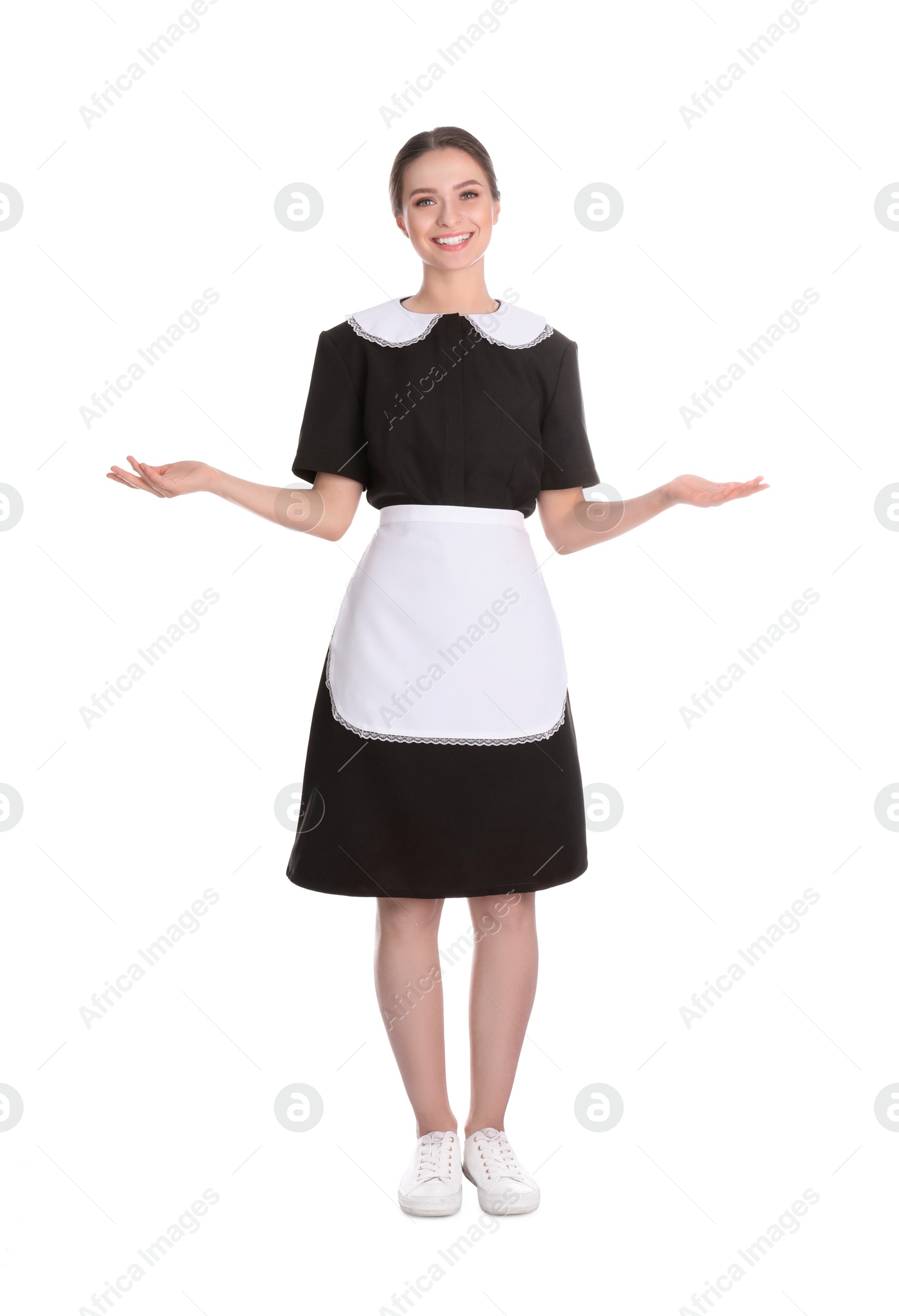 Photo of Young chambermaid in uniform on white background