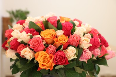 Photo of Bouquet of beautiful rose flowers on blurred background, closeup