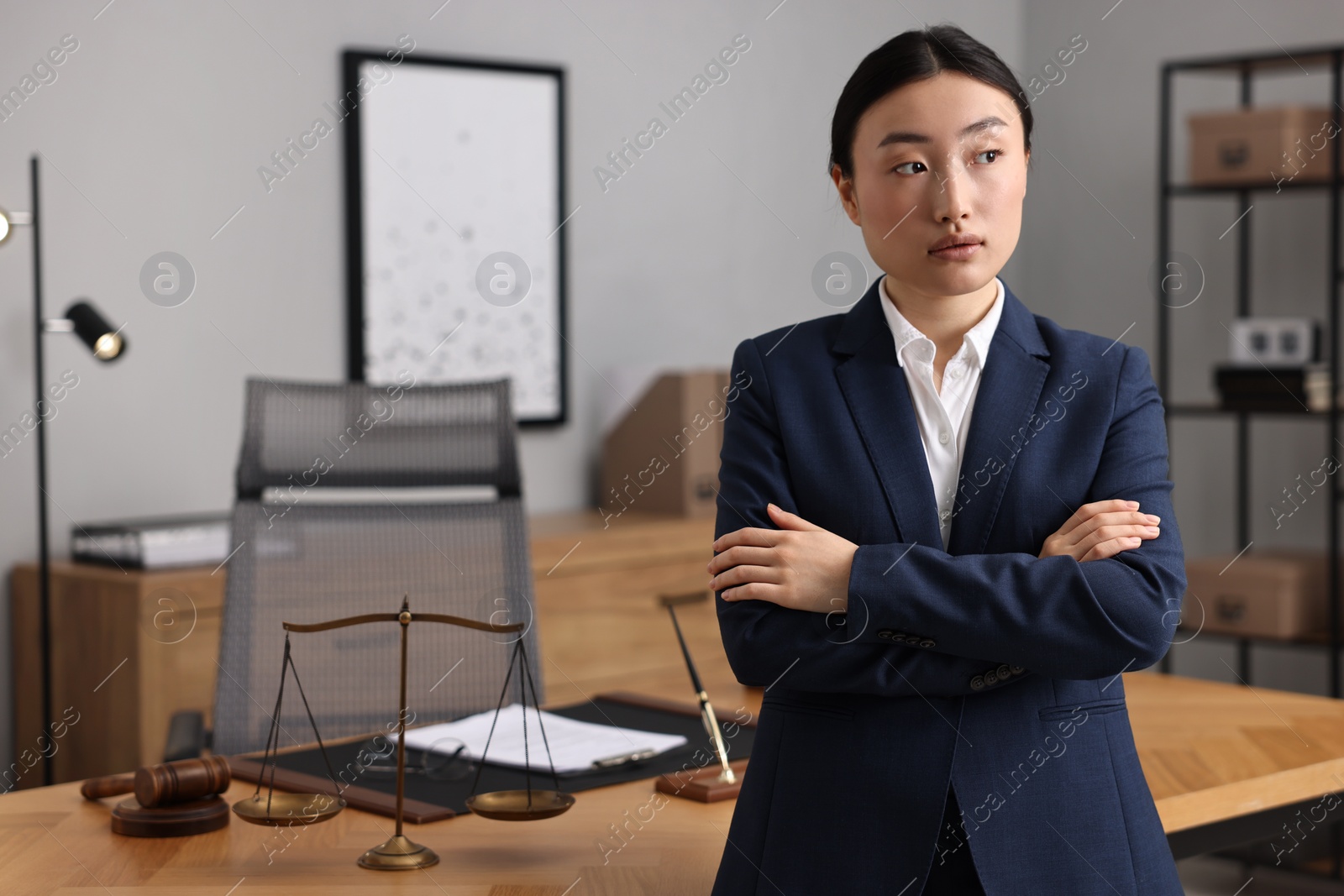 Photo of Portrait of notary with crossed arms in office. Space for text