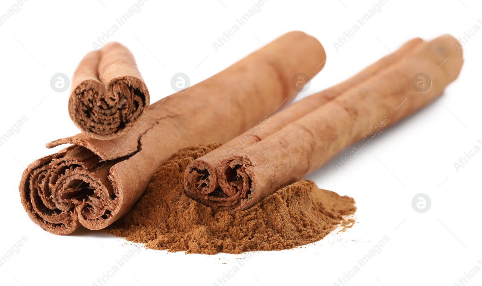 Photo of Dry aromatic cinnamon sticks and powder isolated on white