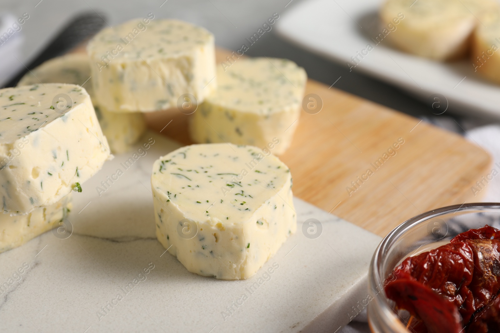 Photo of Tasty butter with dill and chili pepper on table, closeup