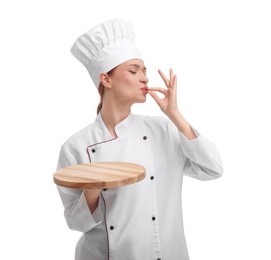 Happy chef in uniform holding empty wooden board and showing perfect sign on white background