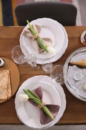 Photo of Festive Passover table setting, top view. Pesach celebration