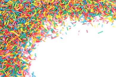 Photo of Colorful sprinkles on white background, top view. Confectionery decor