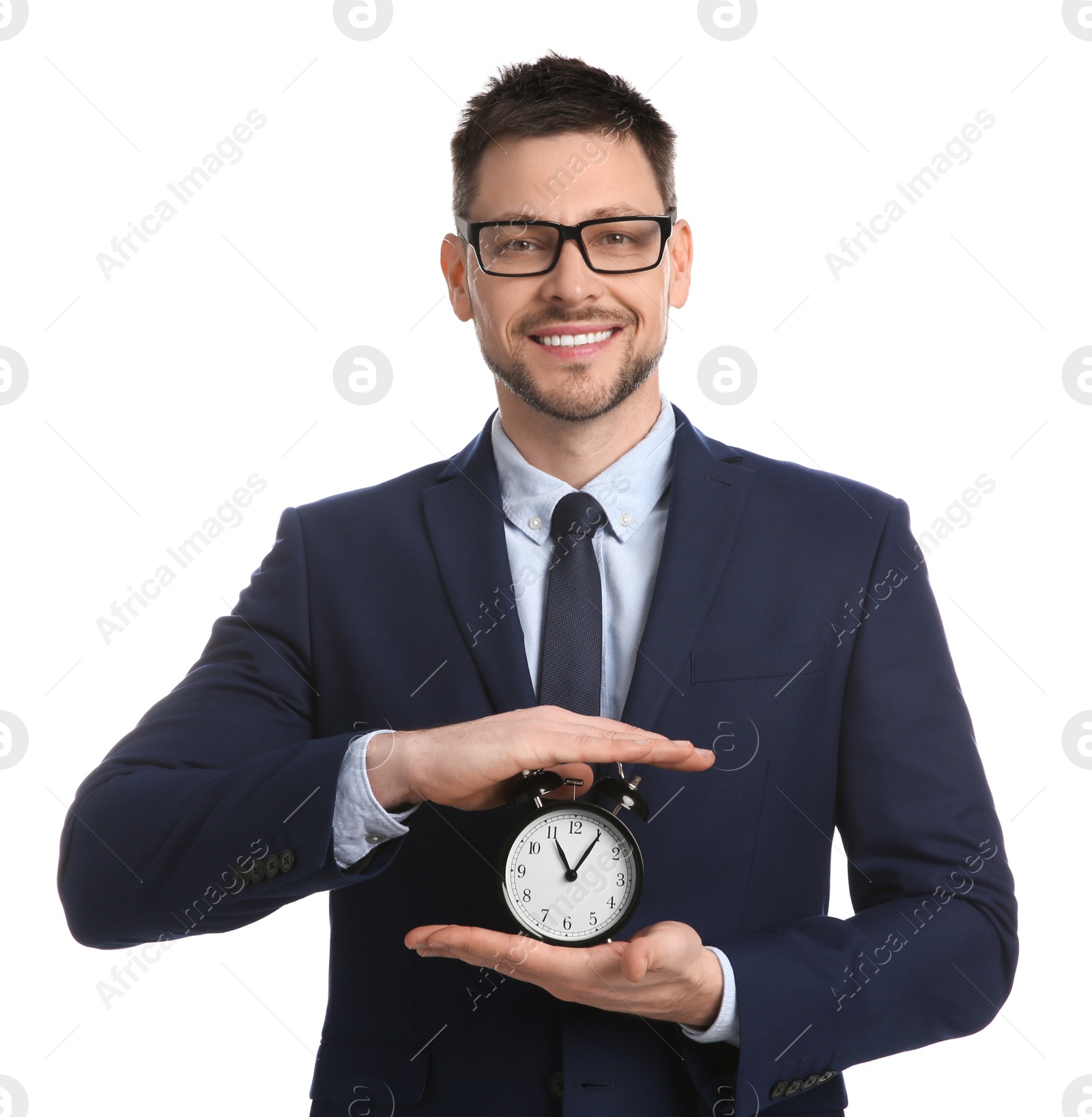 Photo of Happy businessman holding alarm clock on white background. Time management