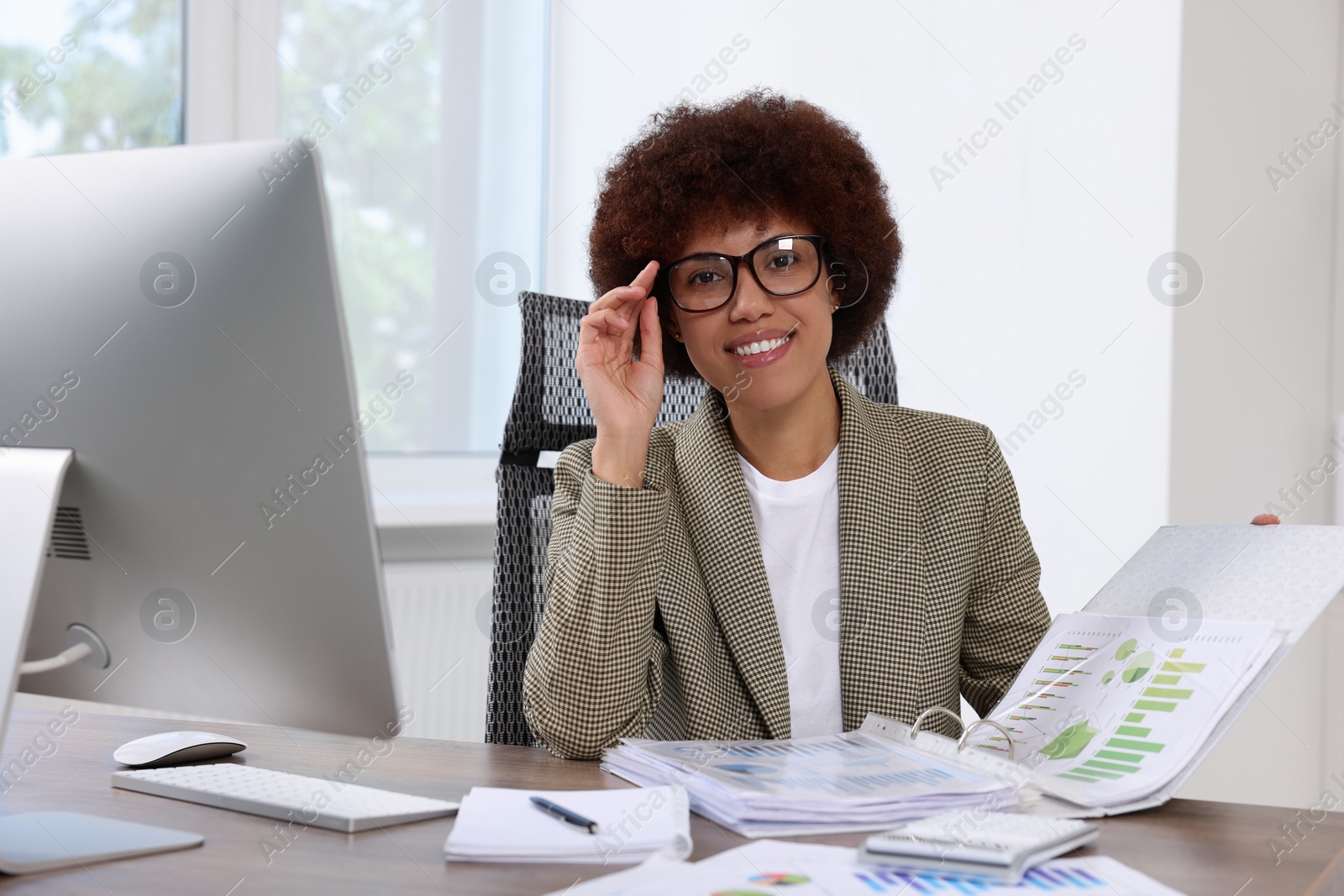 Photo of Professional accountant working at wooden desk in office