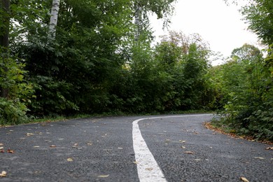 Photo of Beautiful view of pathway in park on autumn day