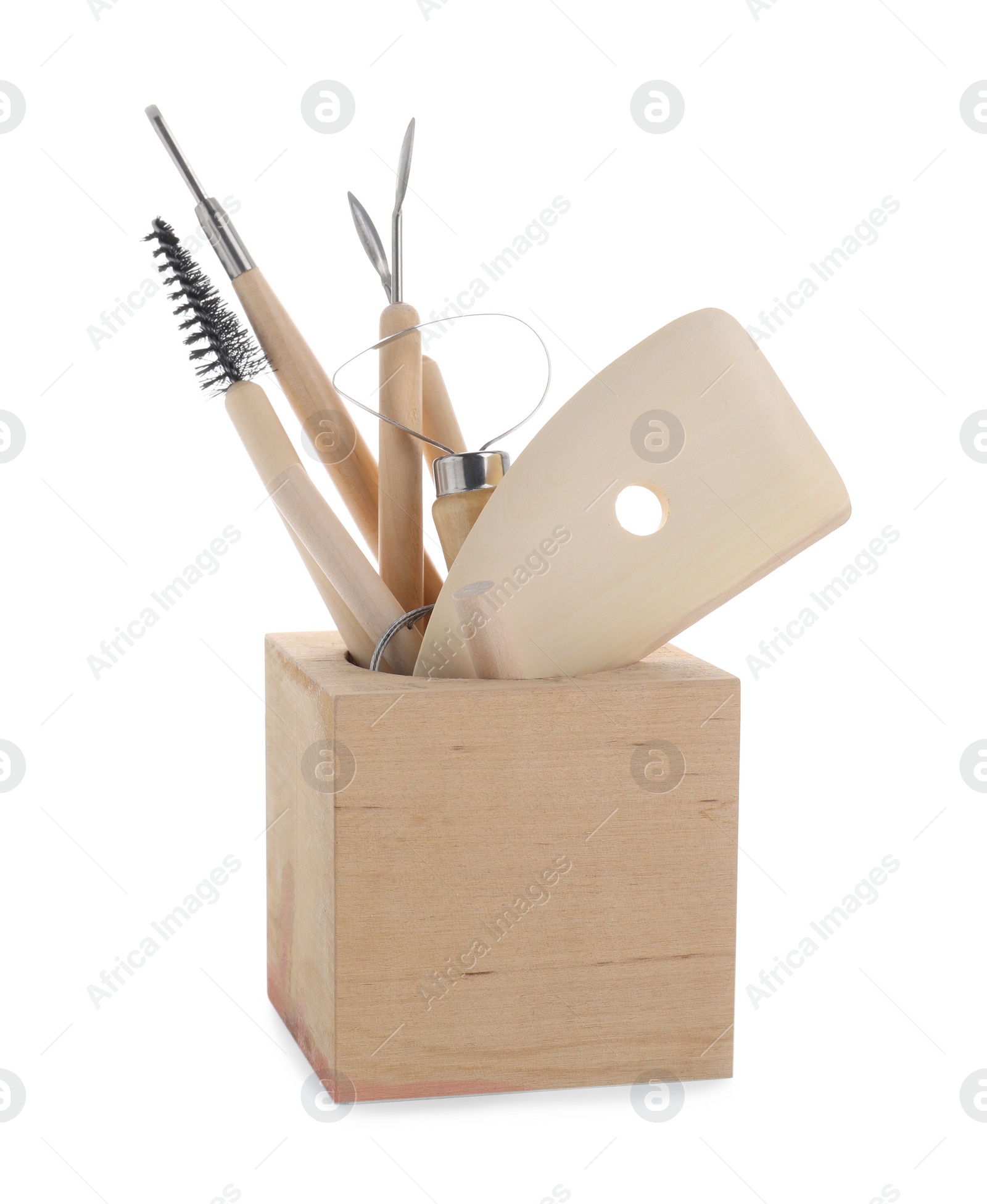 Photo of Set of different clay crafting tools in holder isolated on white