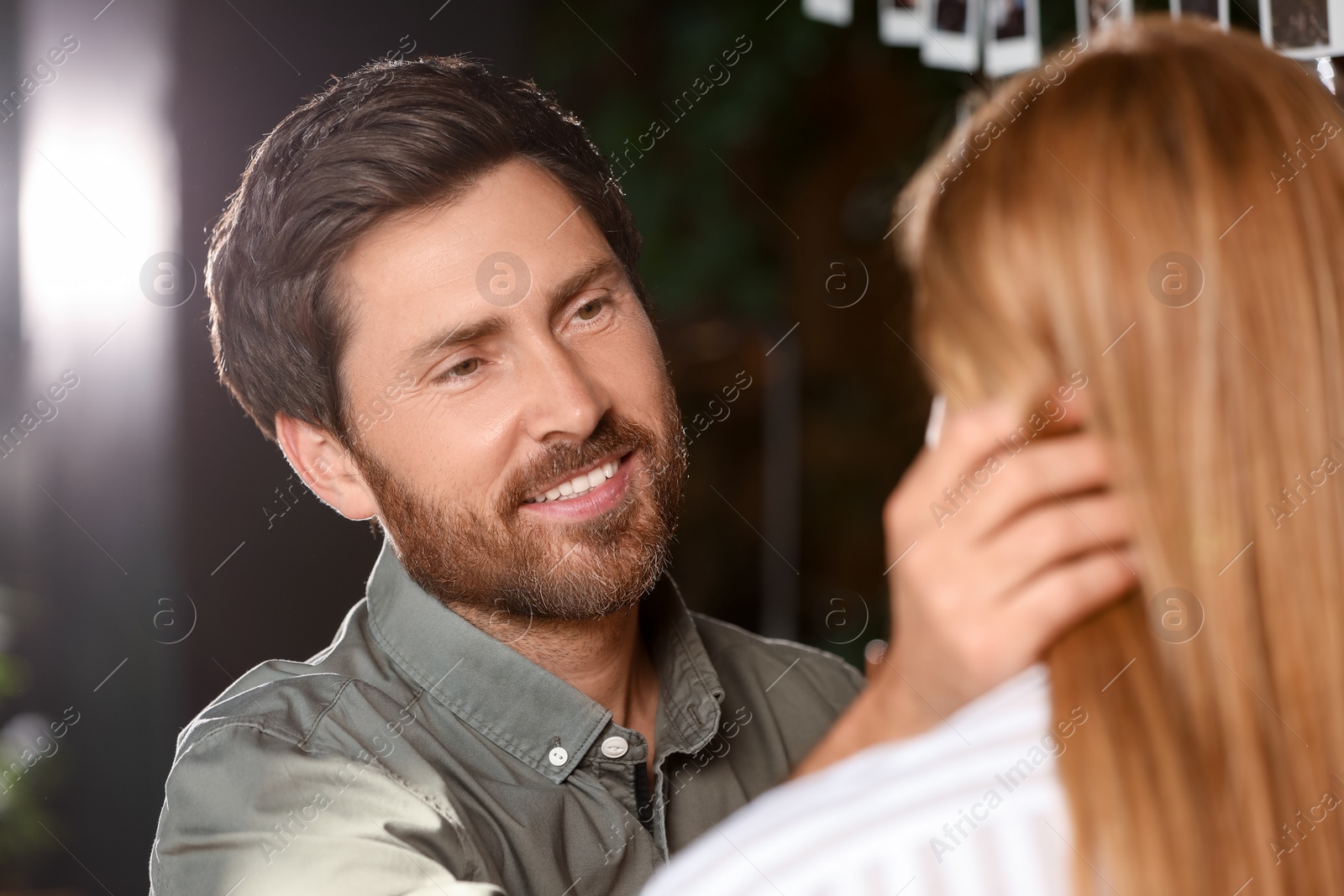 Photo of Romantic date. Lovely couple spending time together indoors