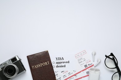 Photo of Composition with passport, tickets and camera on white background, top view. Visa receiving