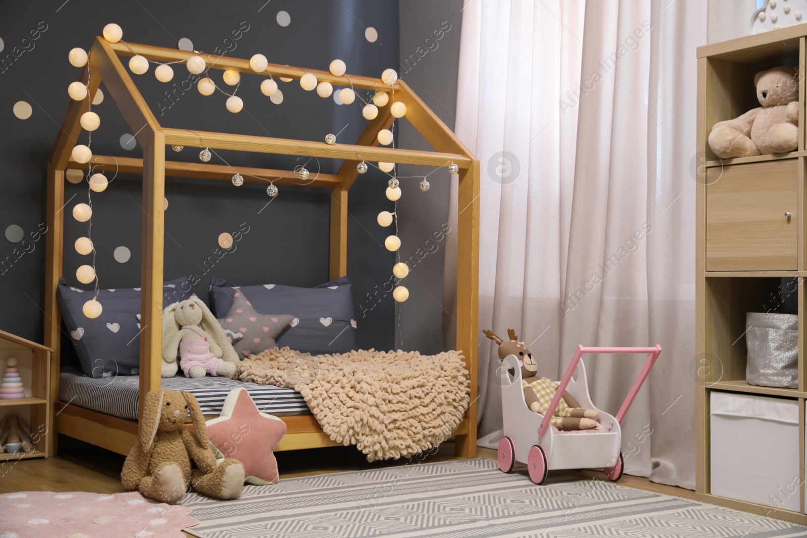 Photo of Stylish child room interior with comfortable bed