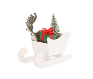 Wooden sleigh with present, decorative reindeer and fir tree on white background. Christmas holidays