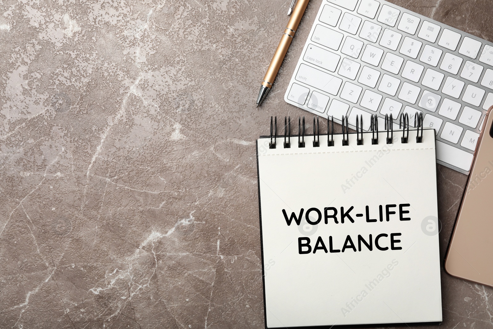 Image of Work-life balance concept. Notebook and keyboard on grey marble table, flat lay