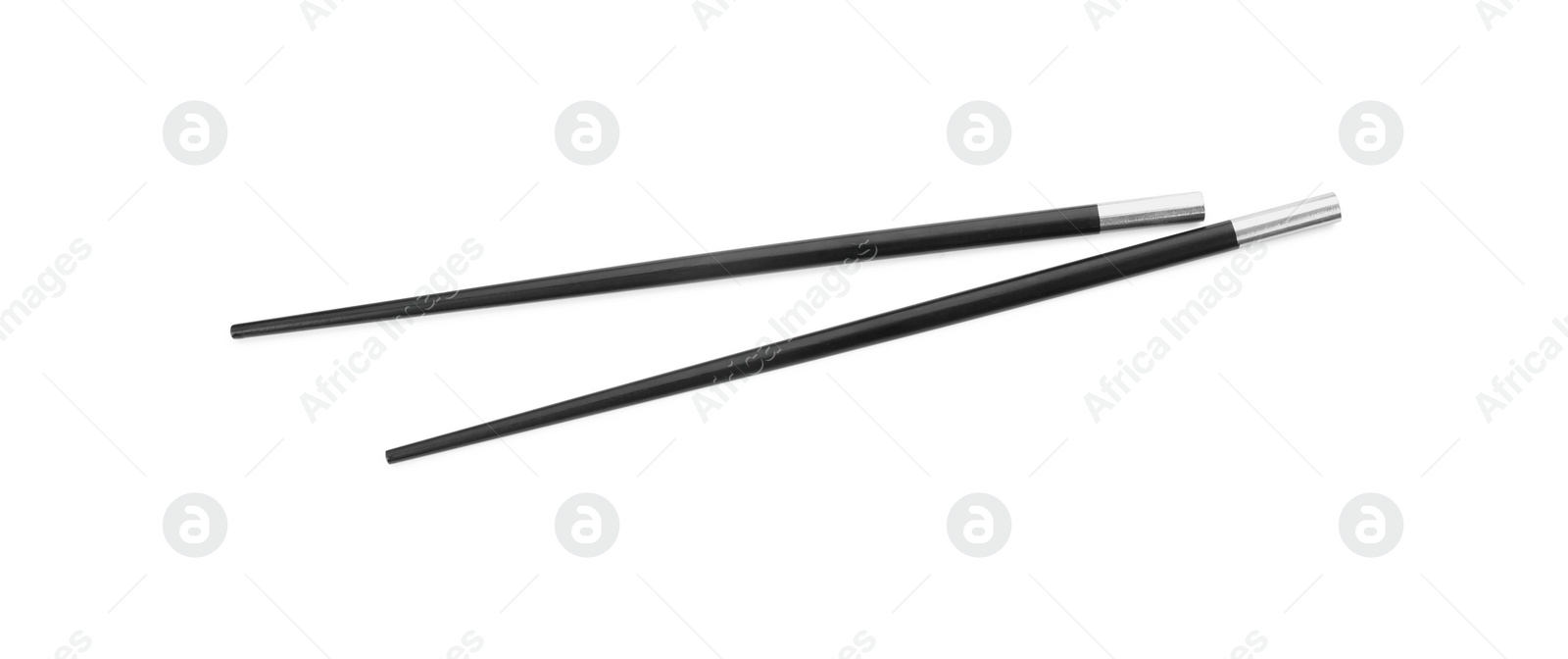 Photo of Pair of black chopsticks isolated on white