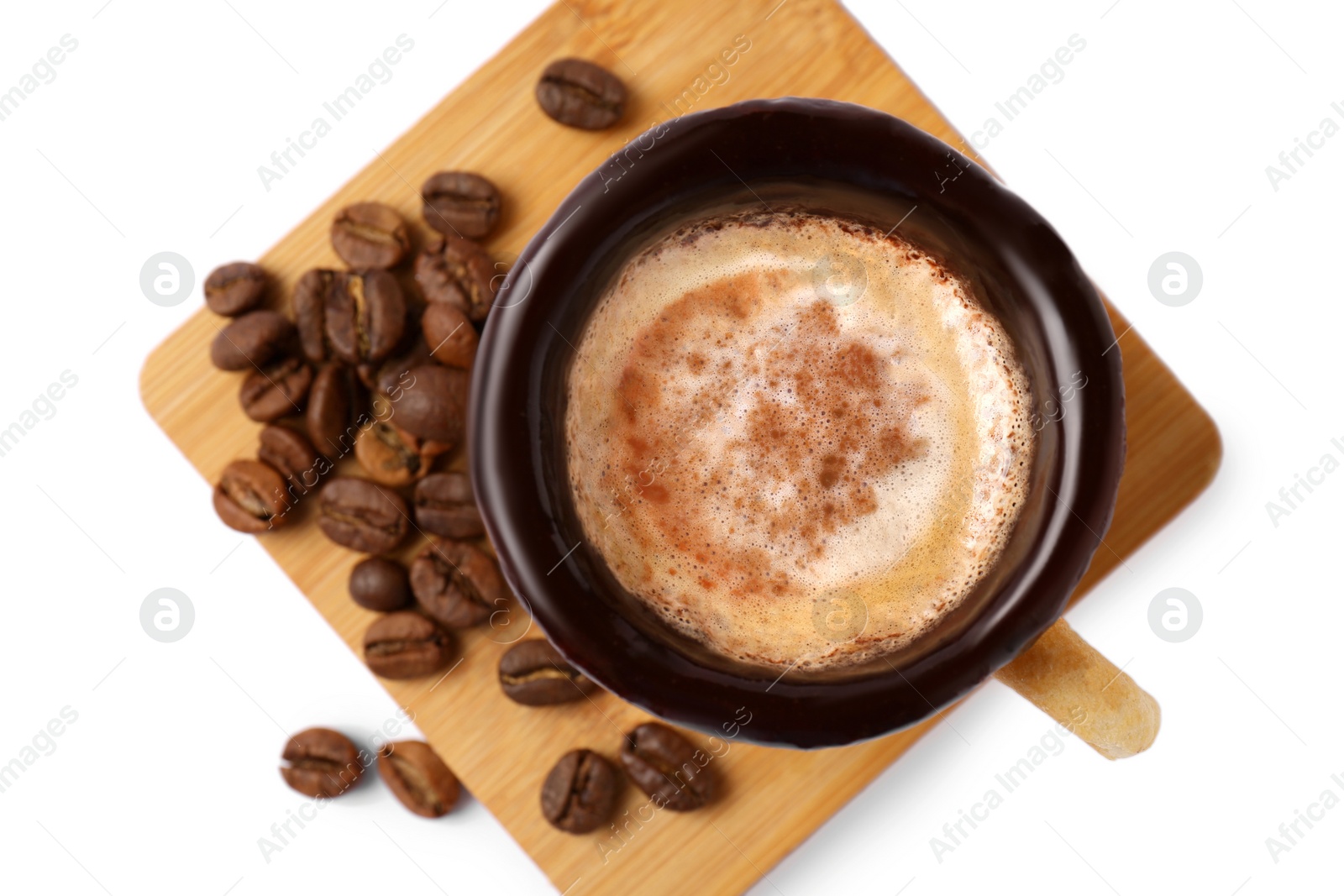 Photo of Delicious edible biscuit cup with coffee and roasted beans on white background, top view