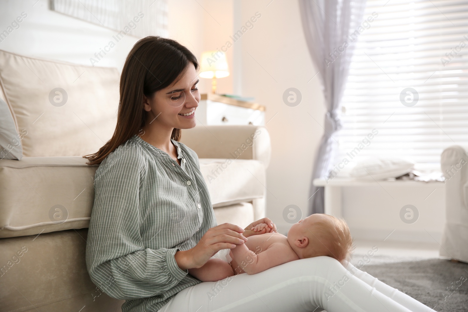 Photo of Mother with her newborn baby at home