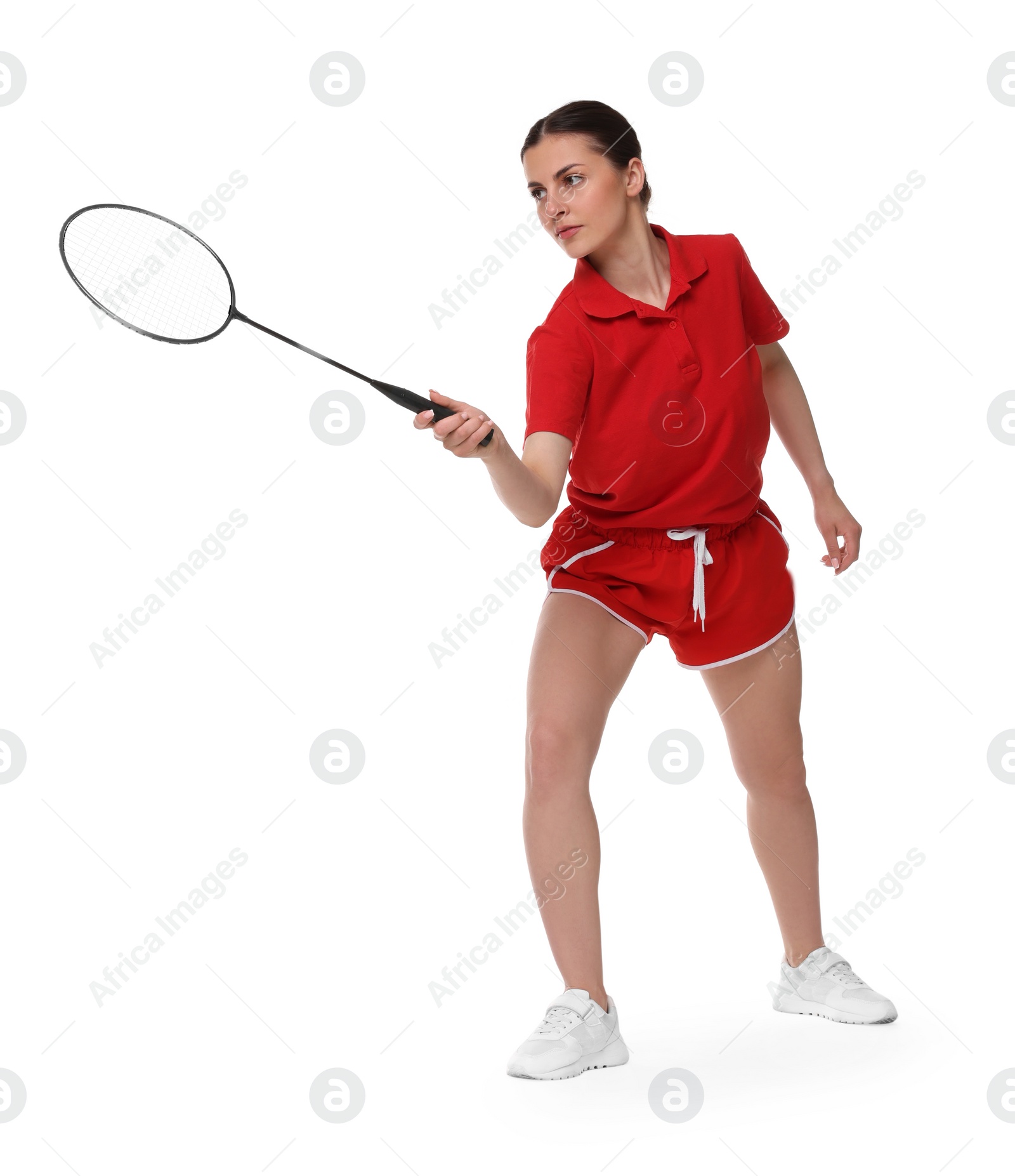 Photo of Young woman playing badminton with racket on white background