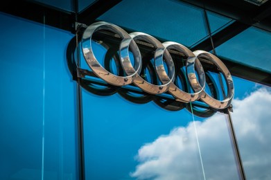 Warshaw, Poland - May 14, 2022: Glass facade of building with Audi logo, closeup