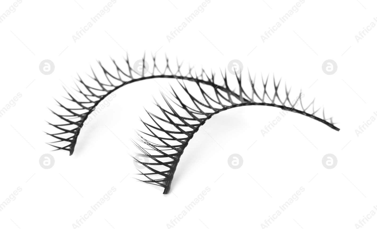 Photo of Fake eyelashes on white background. Makeup product