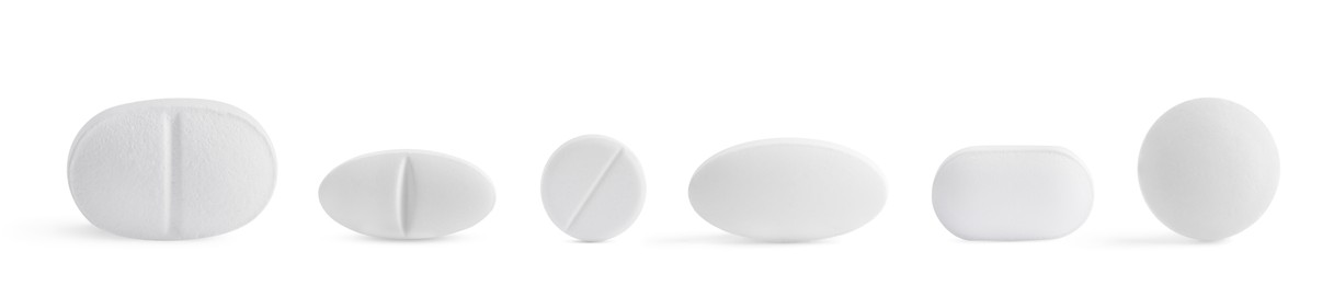 Image of Set of different pills in row isolated on white