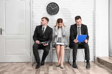 Group of people waiting for job interview, indoors