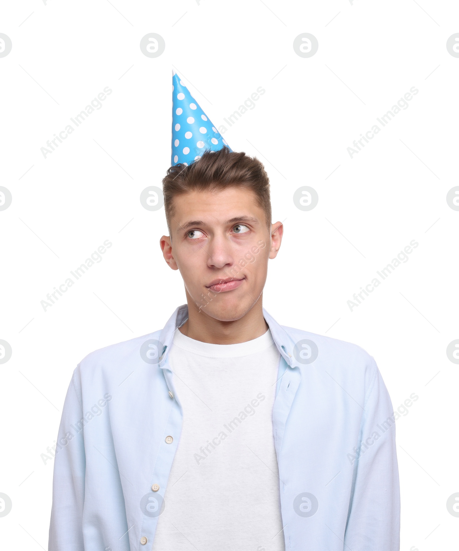 Photo of Young man in party hat on white background