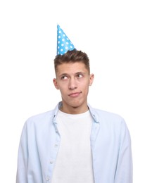 Young man in party hat on white background