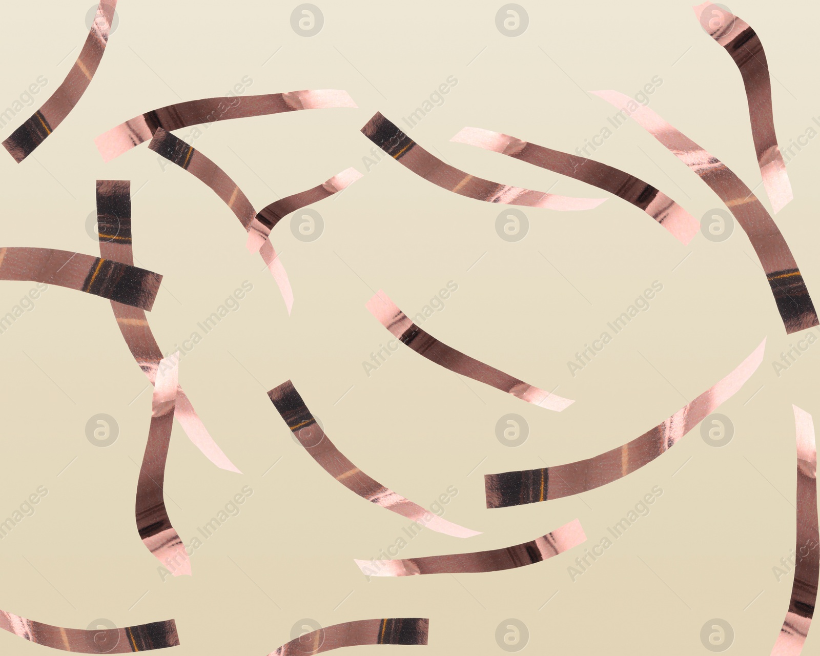 Image of Shiny bronze confetti falling on beige background