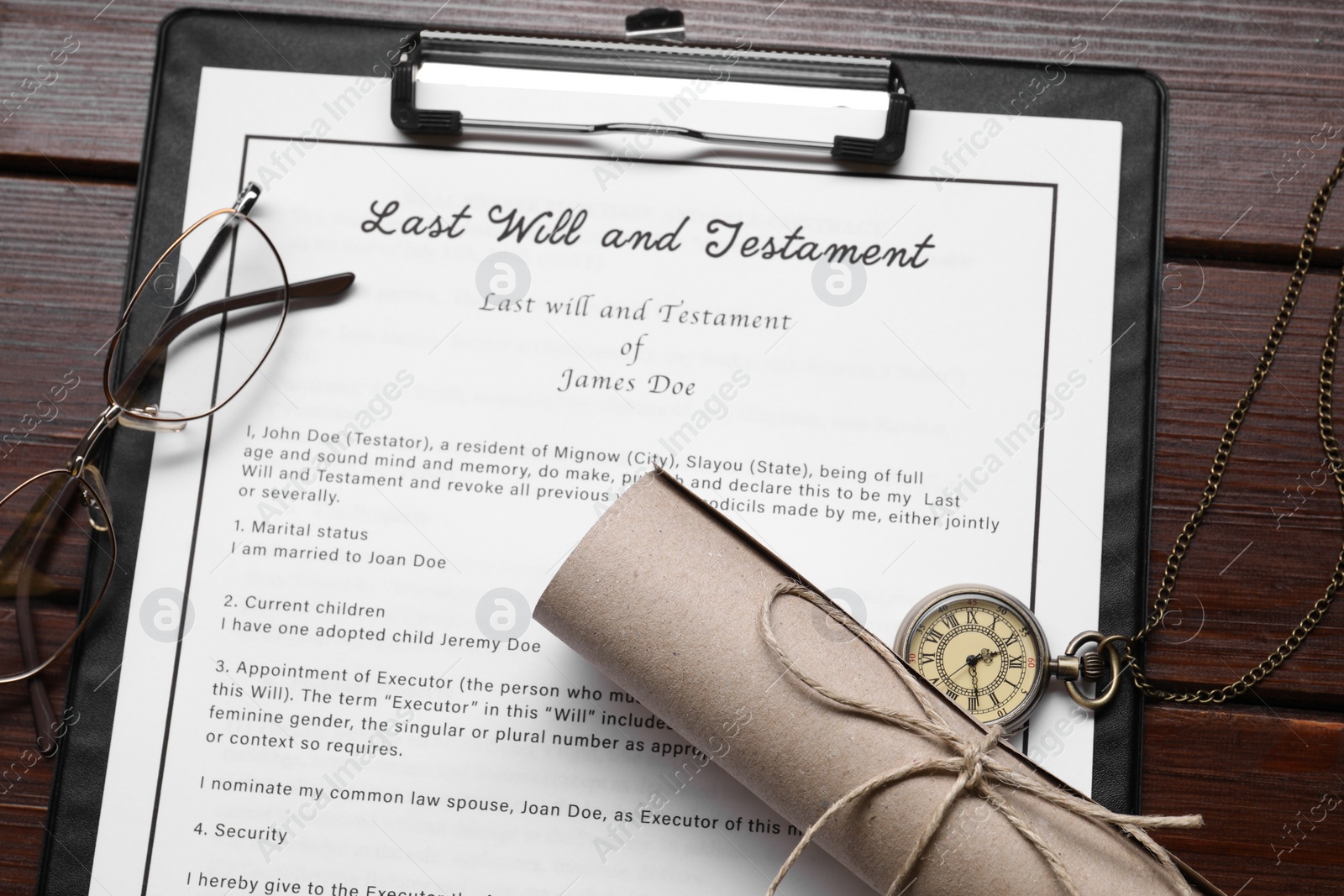 Photo of Last Will and Testament, scroll, glasses and pocket watch on wooden table, flat lay