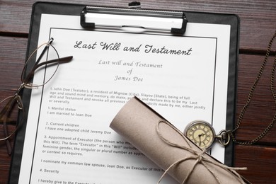Photo of Last Will and Testament, scroll, glasses and pocket watch on wooden table, flat lay