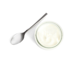 Photo of Tasty organic yogurt in glass jar and spoon isolated on white, top view