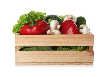 Wooden crate full of fresh ripe vegetables on white background