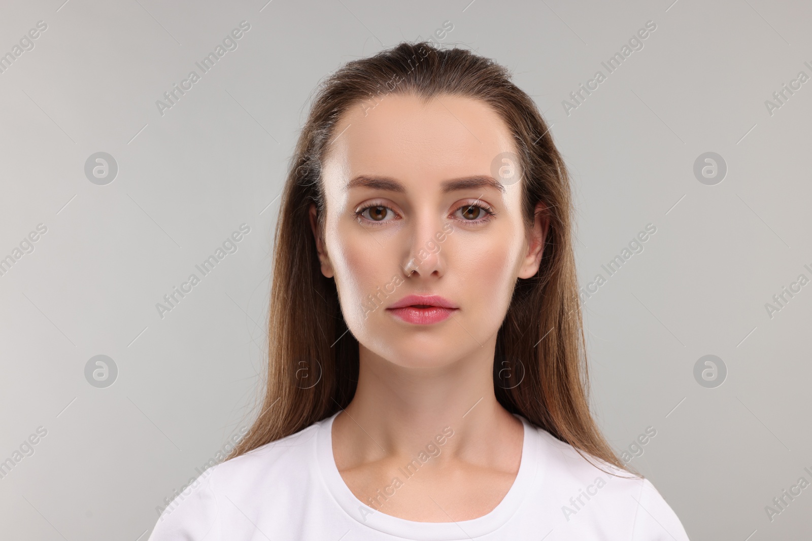 Photo of Portrait of beautiful woman on light gray background