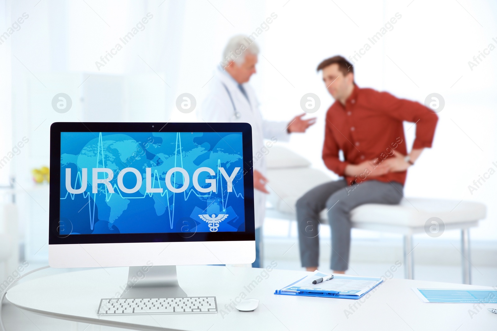 Photo of Computer monitor with word UROLOGY and people on background