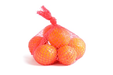 Mesh bag with tangerines on white background