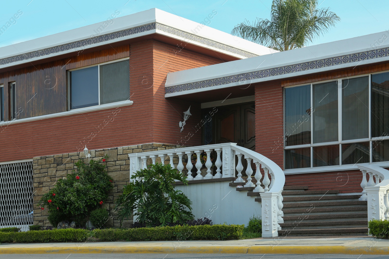 Photo of Exterior of beautiful modern house in city street