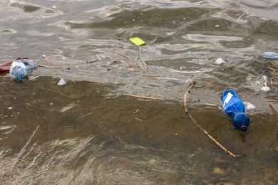 Photo of Plastic garbage floating in river. Environment pollution problem